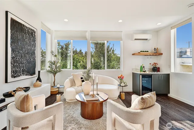 a living room with furniture and a large window