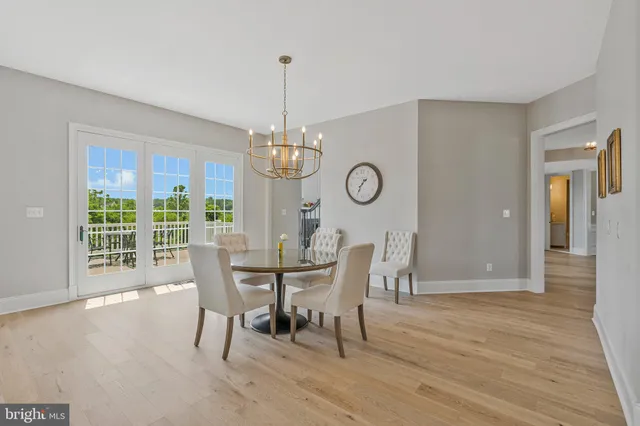 a living room with furniture and a book shelf