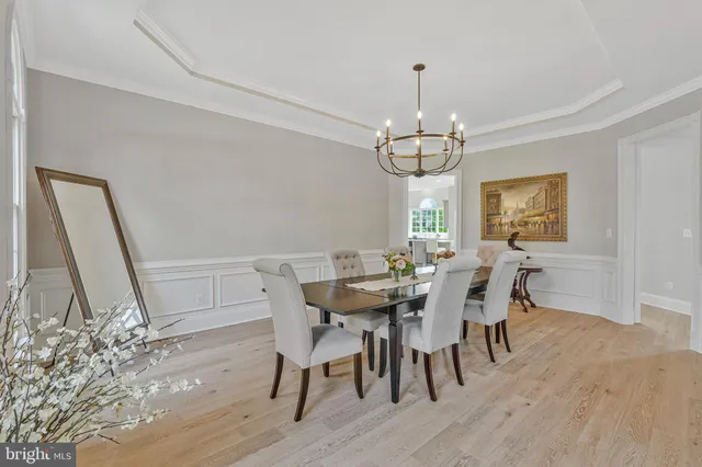 a bedroom with a bed chair and a window