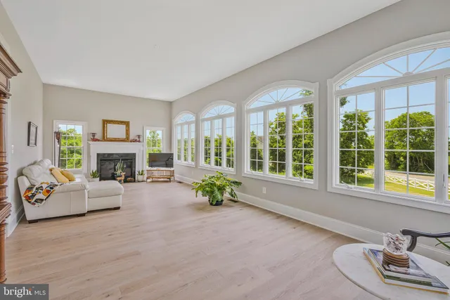 a bathroom with a glass shower door and a sink