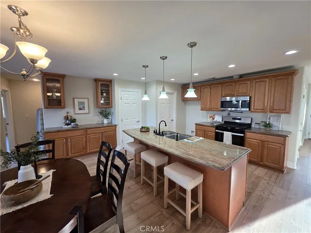 a kitchen with counter space dining table and chairs