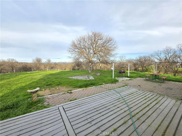 a view of a park with houses in the background