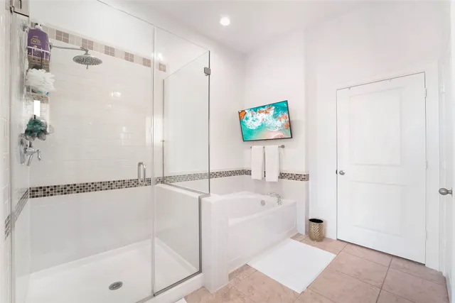 a bathroom with a bathtub and a shower