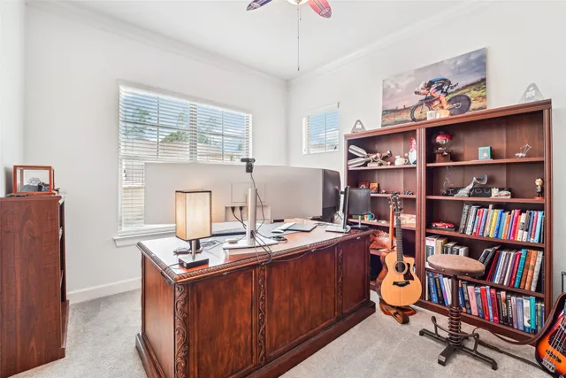 a room with a book shelf and a window