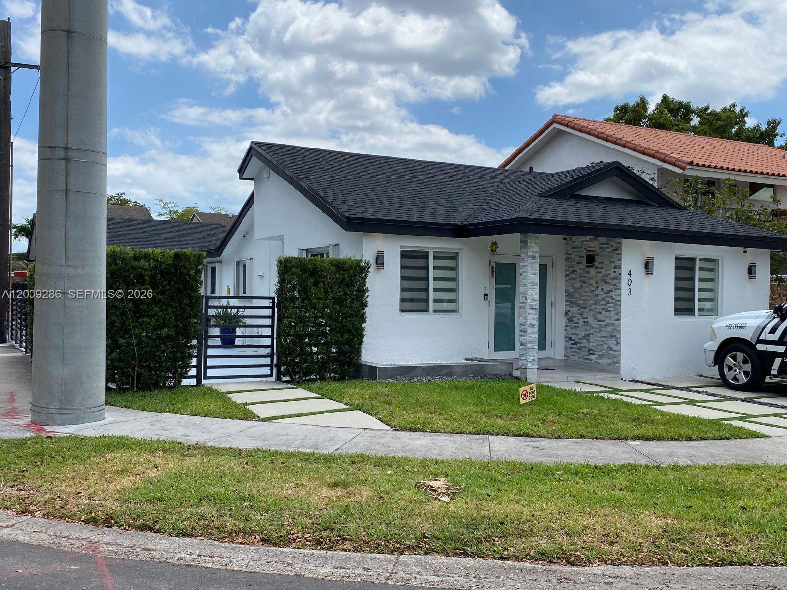 403 Southwest 89th Place Miami, FL 33174 - Photo 1 of 39 a view of a house with a yard and pathway