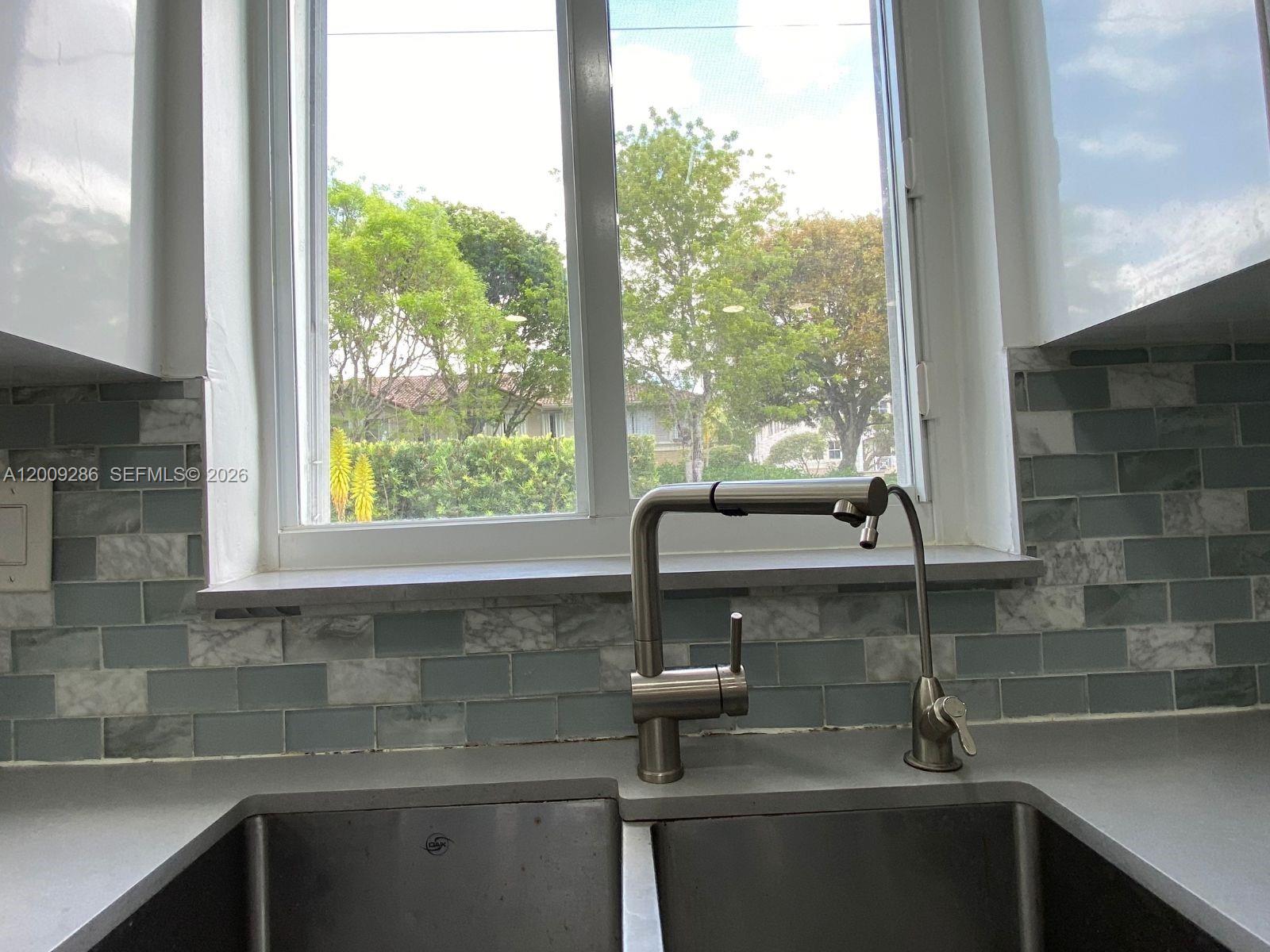 403 Southwest 89th Place Miami, FL 33174 - Photo 11 of 39 a sink with a window