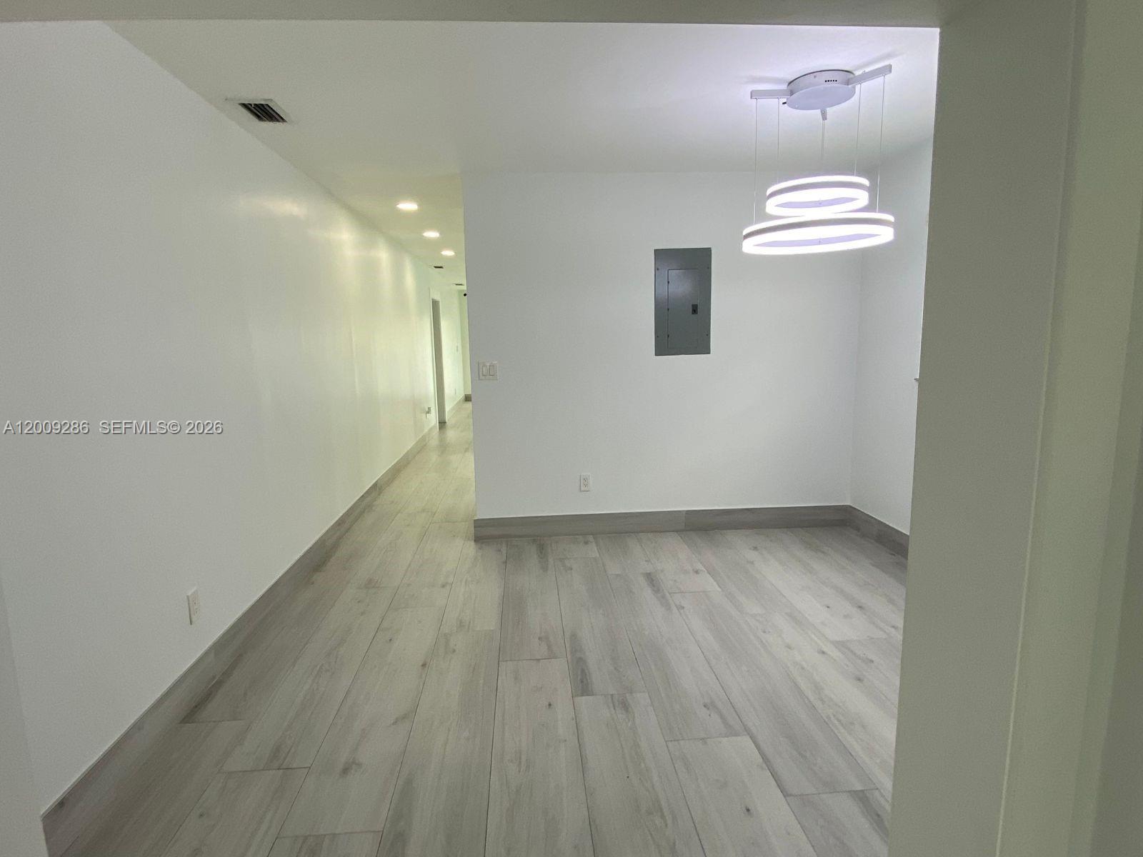 403 Southwest 89th Place Miami, FL 33174 - Photo 12 of 39 a view of a room with wooden floor