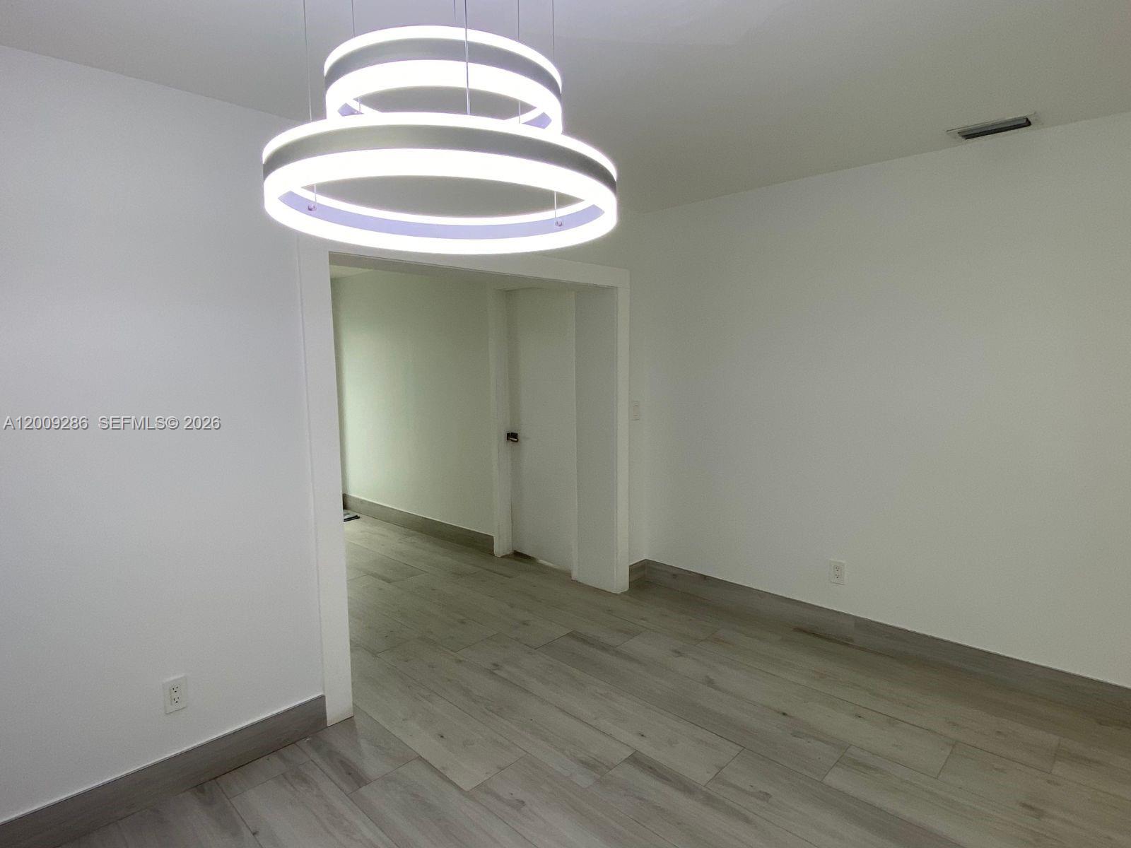 403 Southwest 89th Place Miami, FL 33174 - Photo 14 of 39 a view of a room with a sink and wooden floor