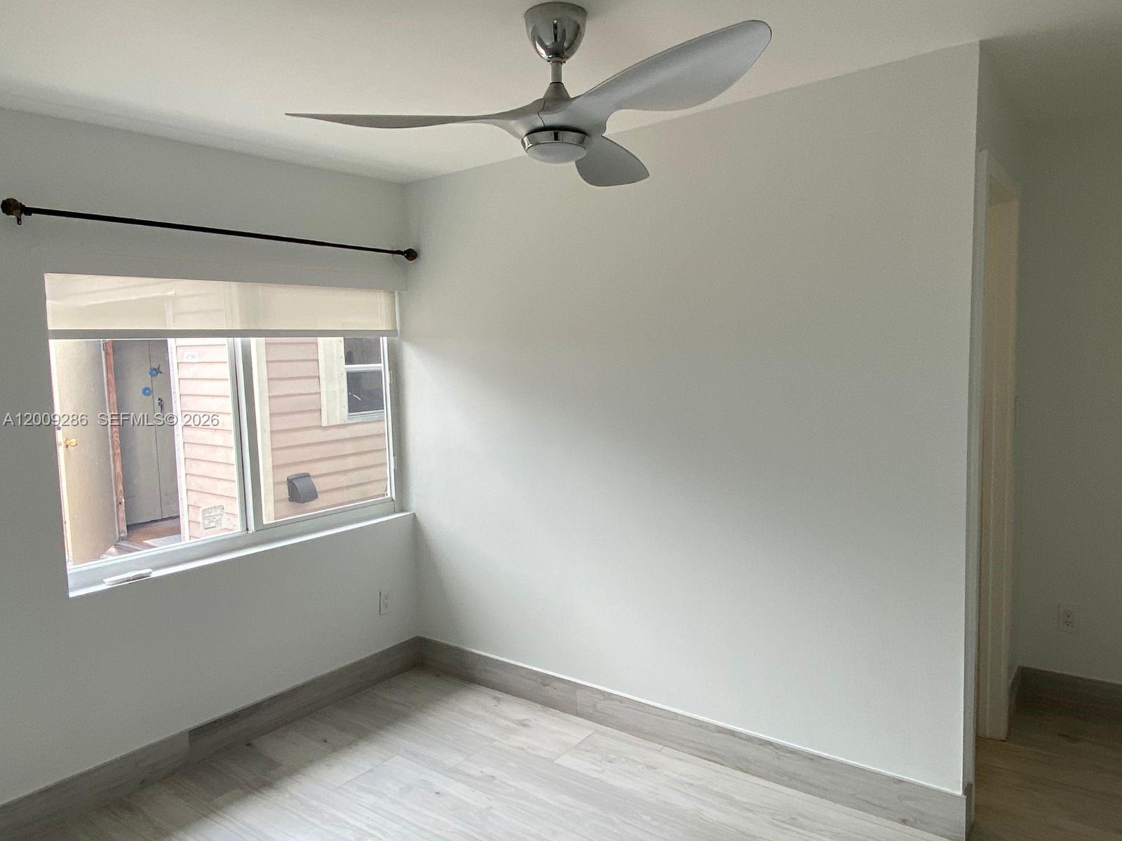 403 Southwest 89th Place Miami, FL 33174 - Photo 26 of 39 an empty room with a window