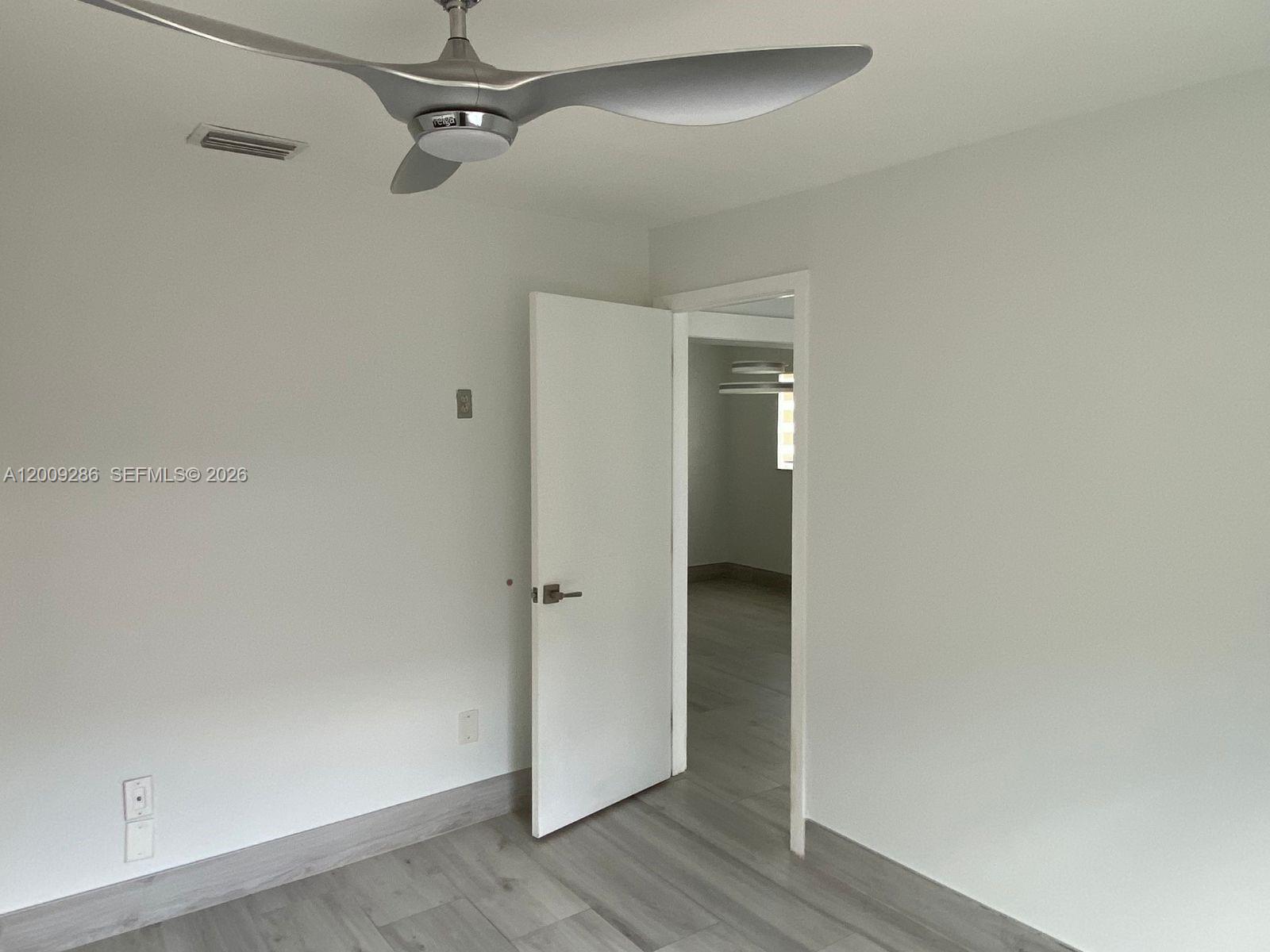403 Southwest 89th Place Miami, FL 33174 - Photo 28 of 39 wooden floor in an empty room