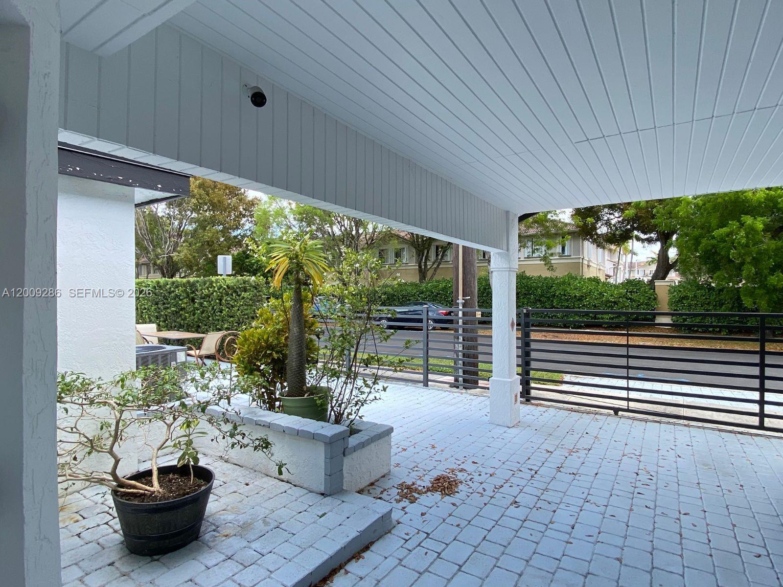 403 Southwest 89th Place Miami, FL 33174 - Photo 38 of 39 a view of a porch with furniture and garden