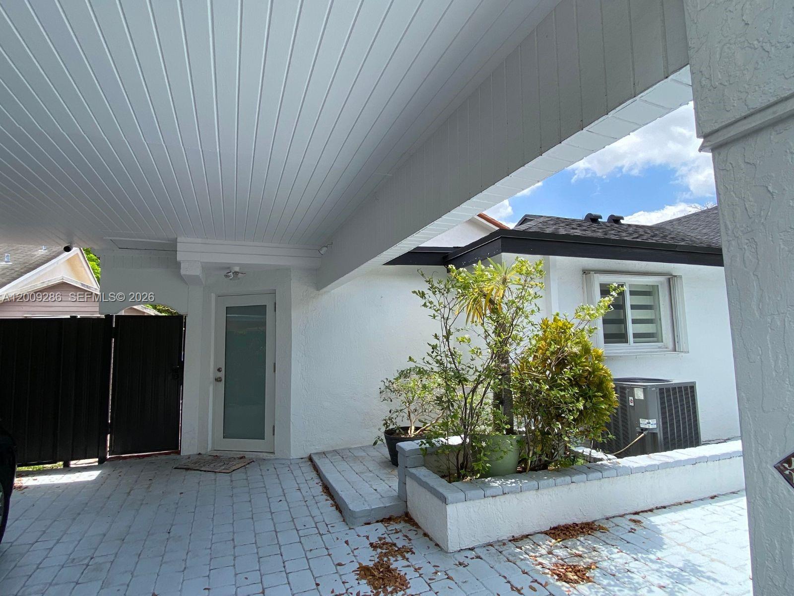 403 Southwest 89th Place Miami, FL 33174 - Photo 39 of 39 a front view of a house with garden