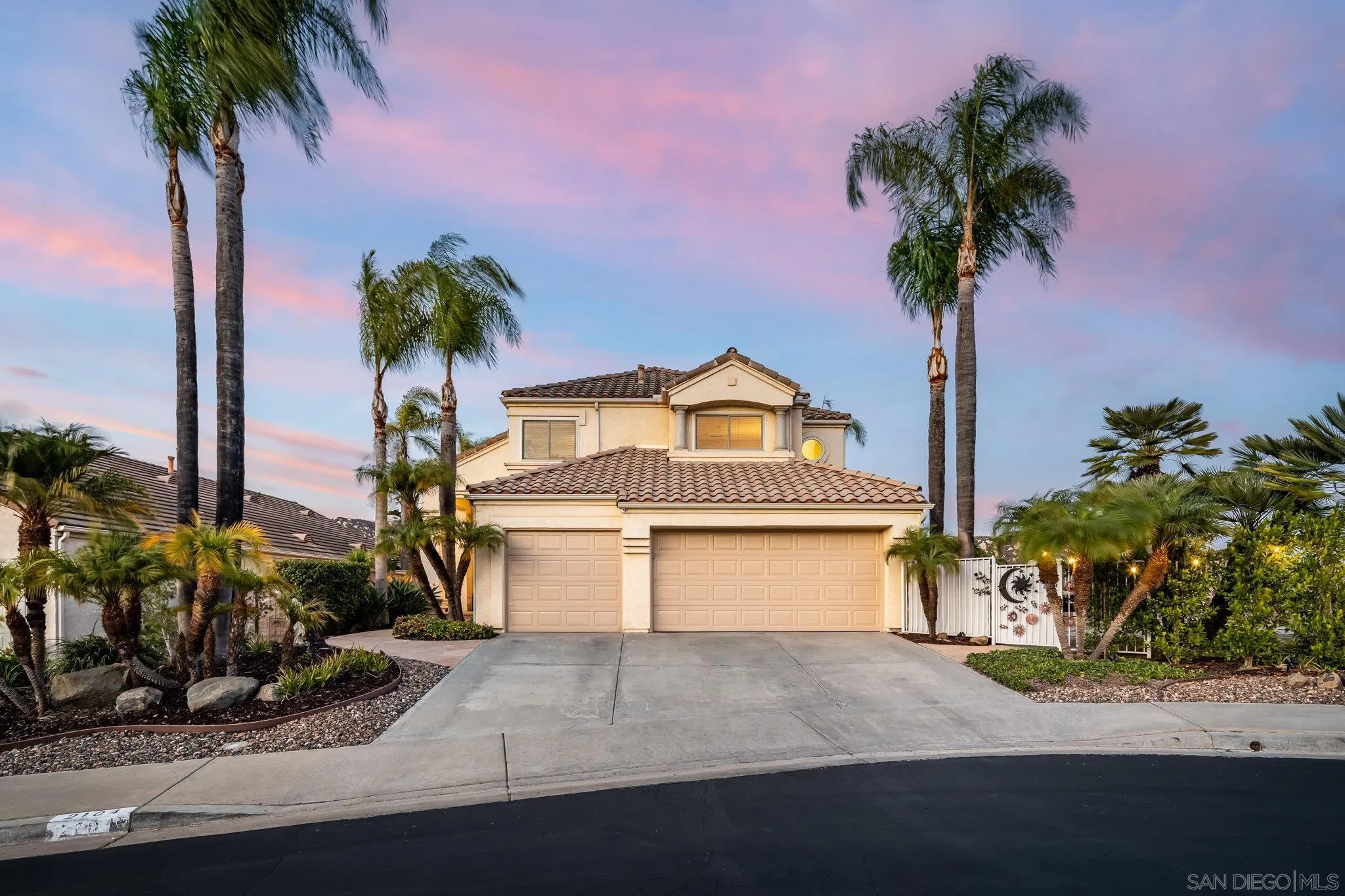 2104 View Crest Glen Escondido, CA 92026 - Photo 20 of 22 a front view of a house with a garden and a tree
