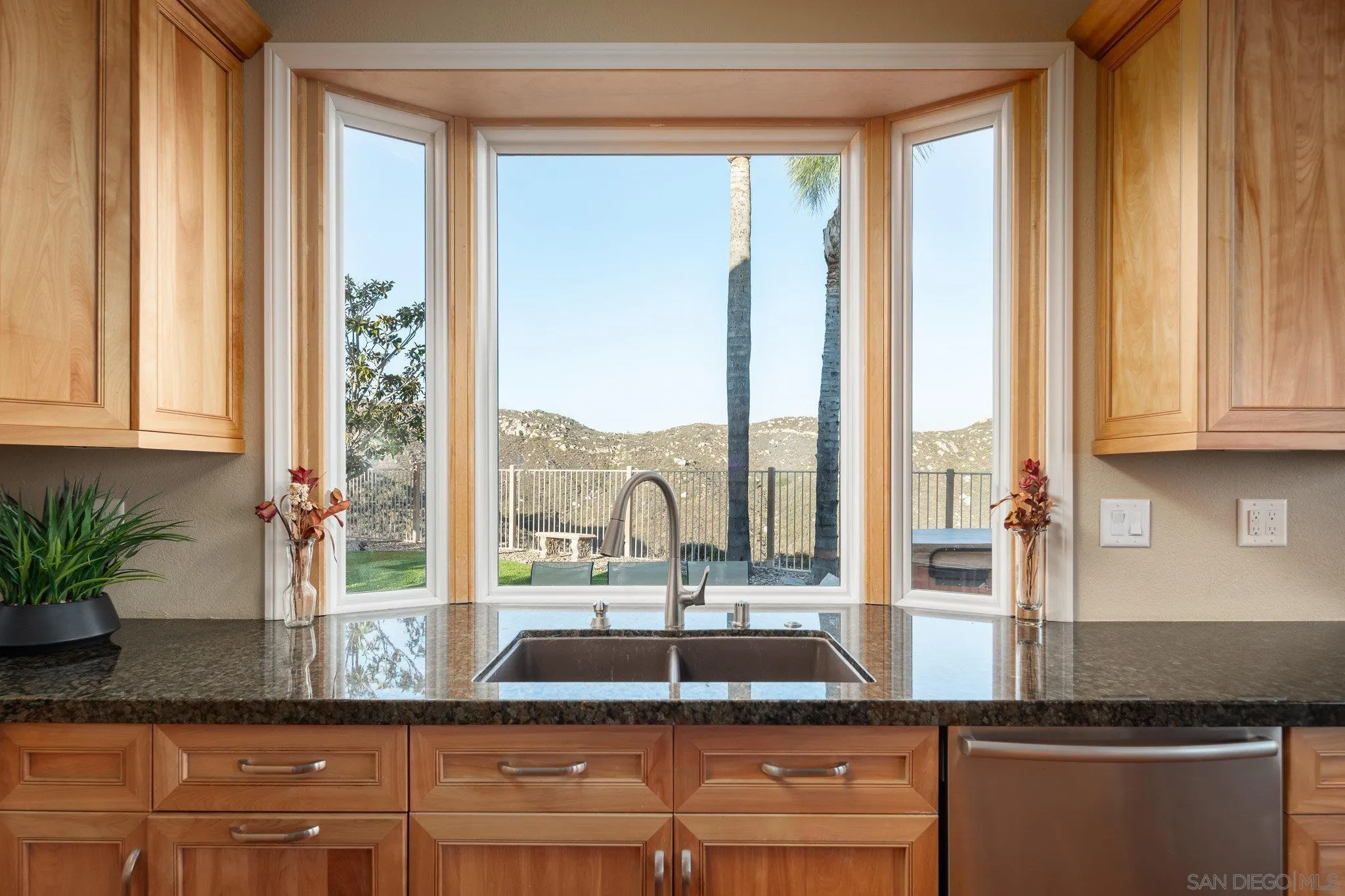 2104 View Crest Glen Escondido, CA 92026 - Photo 7 of 22 a kitchen with a window a sink and cabinets