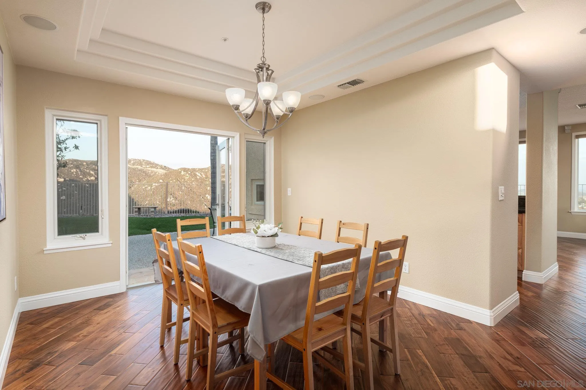 2104 View Crest Glen Escondido, CA 92026 - Photo 10 of 22 a view of a dining room with furniture window and wooden floor