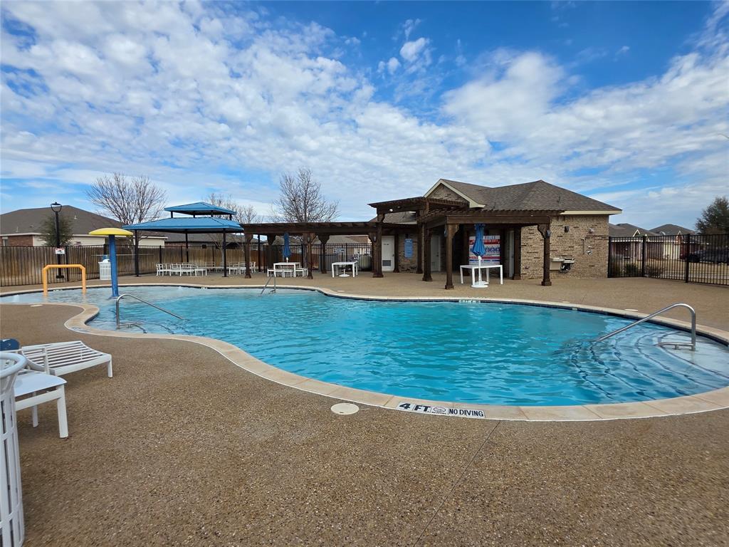 149 Ryan Street Anna, TX 75409 - Photo 35 of 38 an outdoor view of house with outdoor space and swimming pool