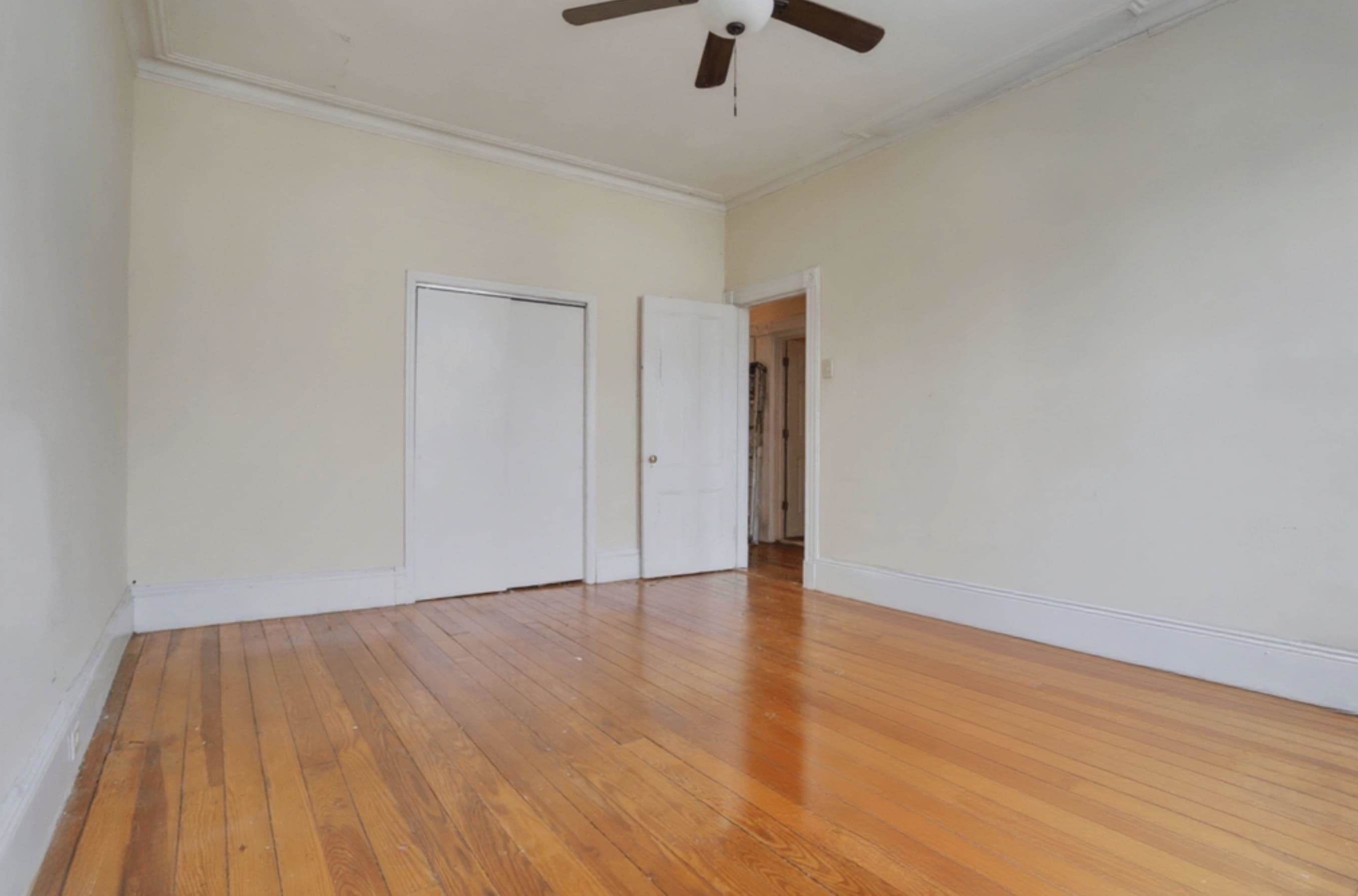 58 Prospect Street, Unit 2 Jersey City, NJ 07307 - Photo 17 of 26 a view of an empty room with wooden floor