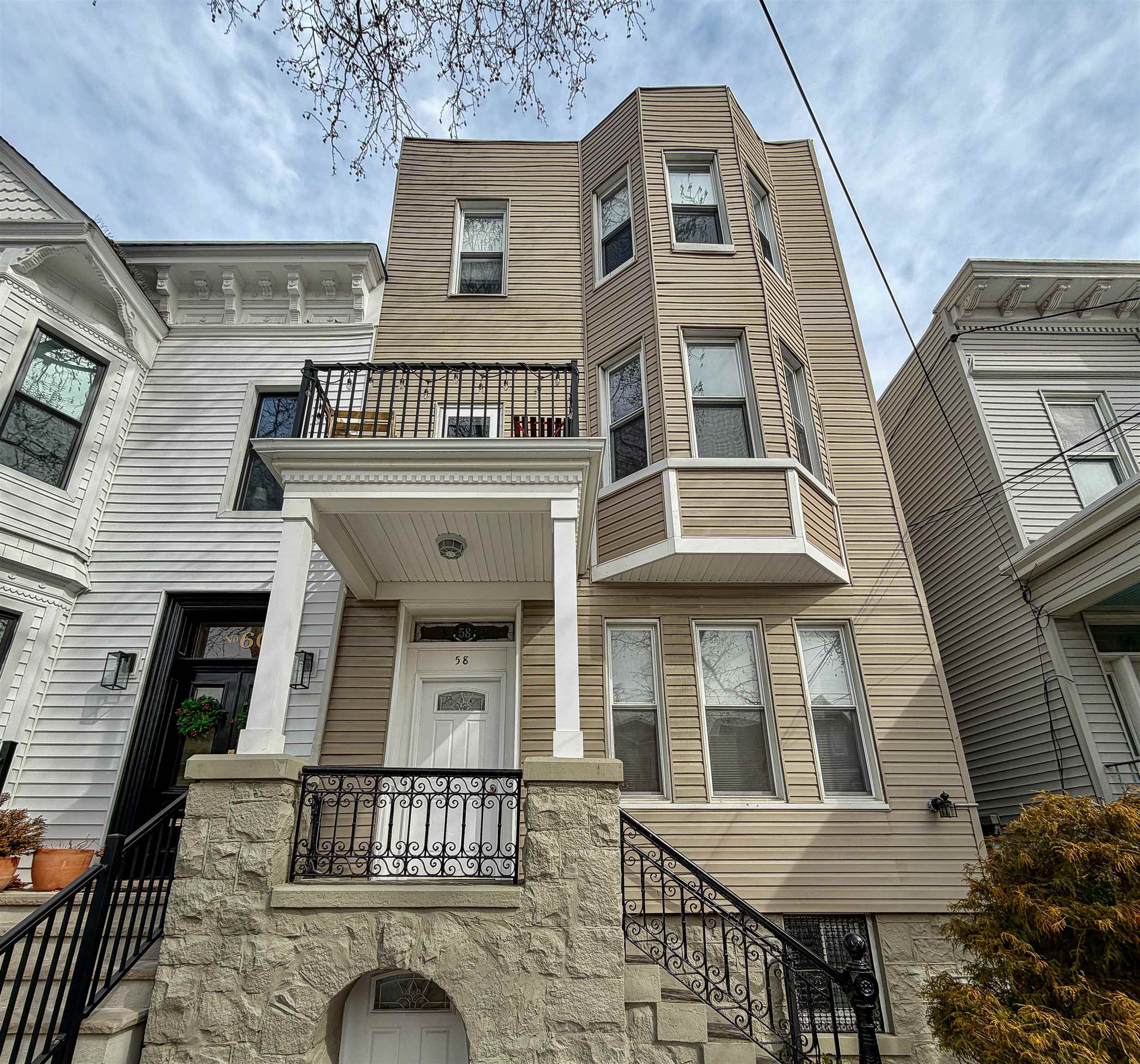 58 Prospect Street, Unit 2 Jersey City, NJ 07307 - Photo 20 of 26 a front view of a house with a balcony