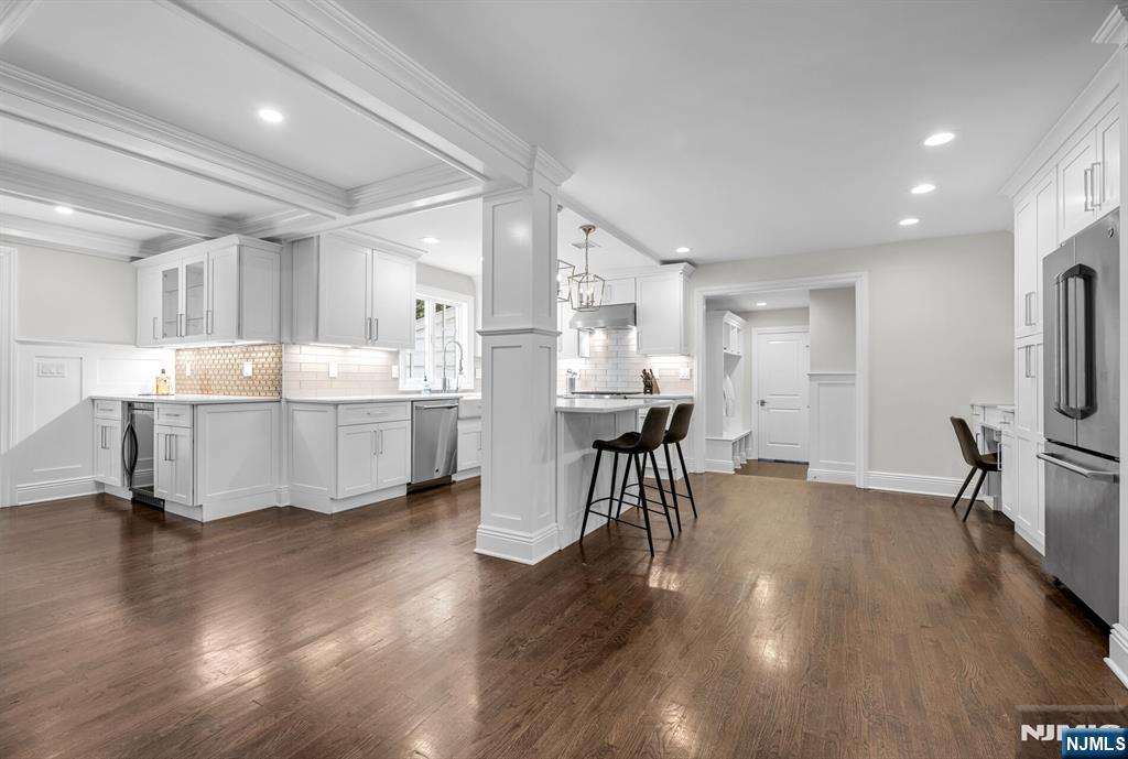 267 Merlin Place Wyckoff, NJ 07481 - Photo 13 of 49 a large kitchen with a table and chairs