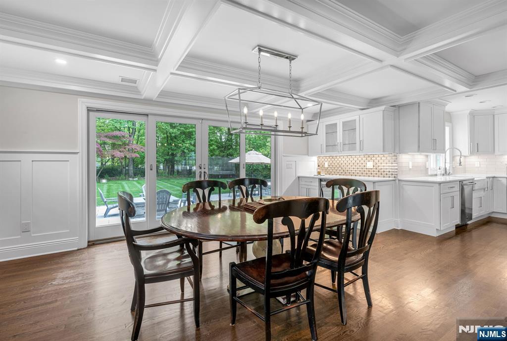 267 Merlin Place Wyckoff, NJ 07481 - Photo 15 of 49 a dining room with furniture a chandelier and wooden floor