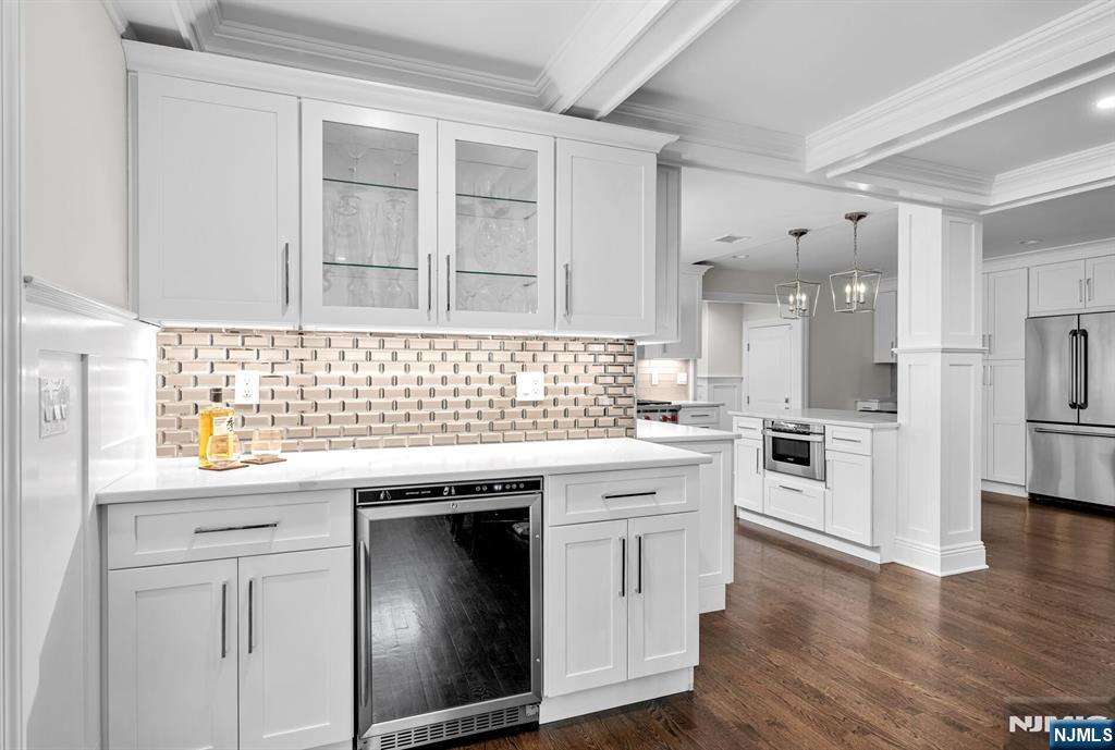 267 Merlin Place Wyckoff, NJ 07481 - Photo 17 of 49 a kitchen with granite countertop white cabinets and white appliances