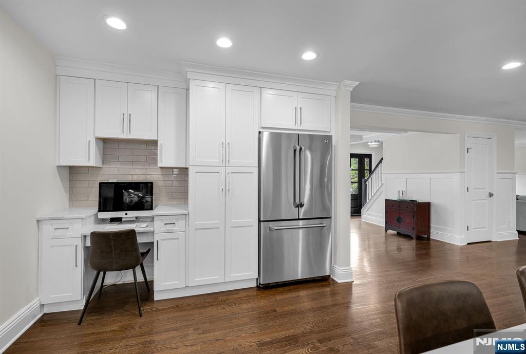 267 Merlin Place Wyckoff, NJ 07481 - Photo 23 of 49 a kitchen with a refrigerator a stove a microwave and cabinets