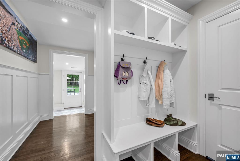 267 Merlin Place Wyckoff, NJ 07481 - Photo 24 of 49 a view of a hallway with furniture and wooden floor