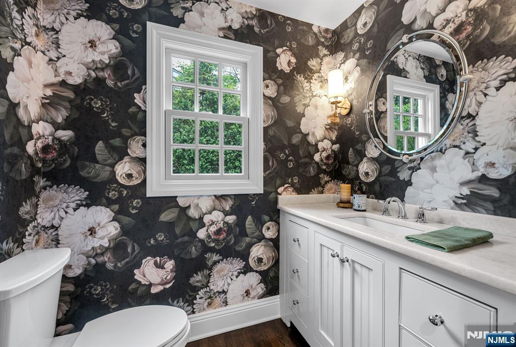 267 Merlin Place Wyckoff, NJ 07481 - Photo 26 of 49 a bathroom with a toilet sink and mirror