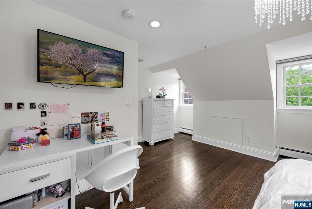 267 Merlin Place Wyckoff, NJ 07481 - Photo 34 of 49 a workspace with furniture and wooden floor