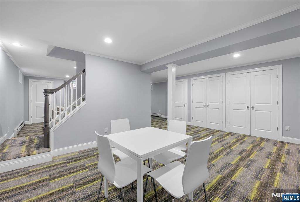 267 Merlin Place Wyckoff, NJ 07481 - Photo 39 of 49 a view of a dining room with furniture and wooden floor