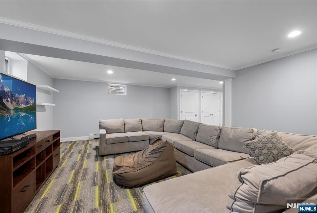 267 Merlin Place Wyckoff, NJ 07481 - Photo 41 of 49 a living room with furniture and a flat screen tv