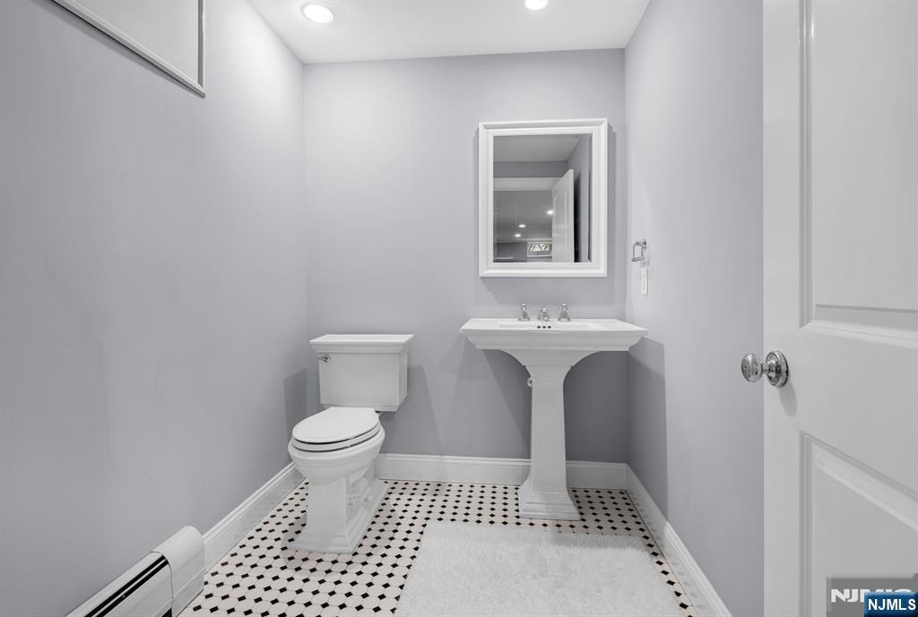 267 Merlin Place Wyckoff, NJ 07481 - Photo 42 of 49 a bathroom with a sink and a toilet