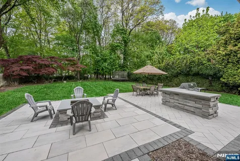 a view of a house with a yard and plants