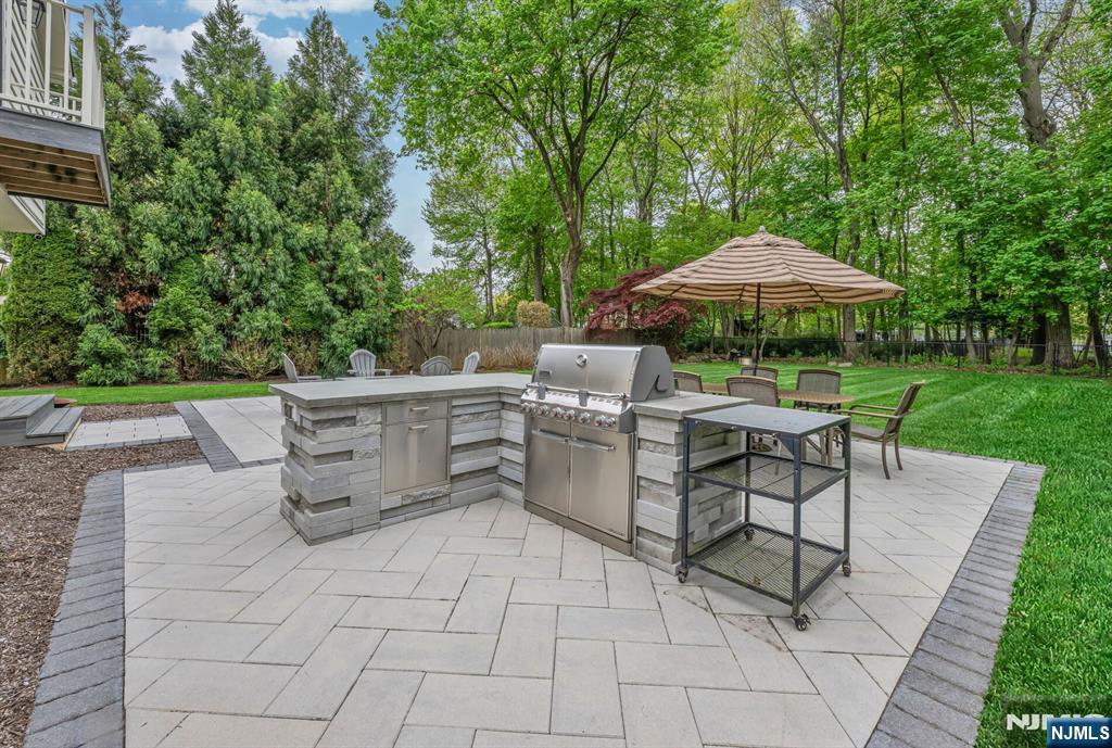 267 Merlin Place Wyckoff, NJ 07481 - Photo 46 of 49 a view of backyard with seating space and trees