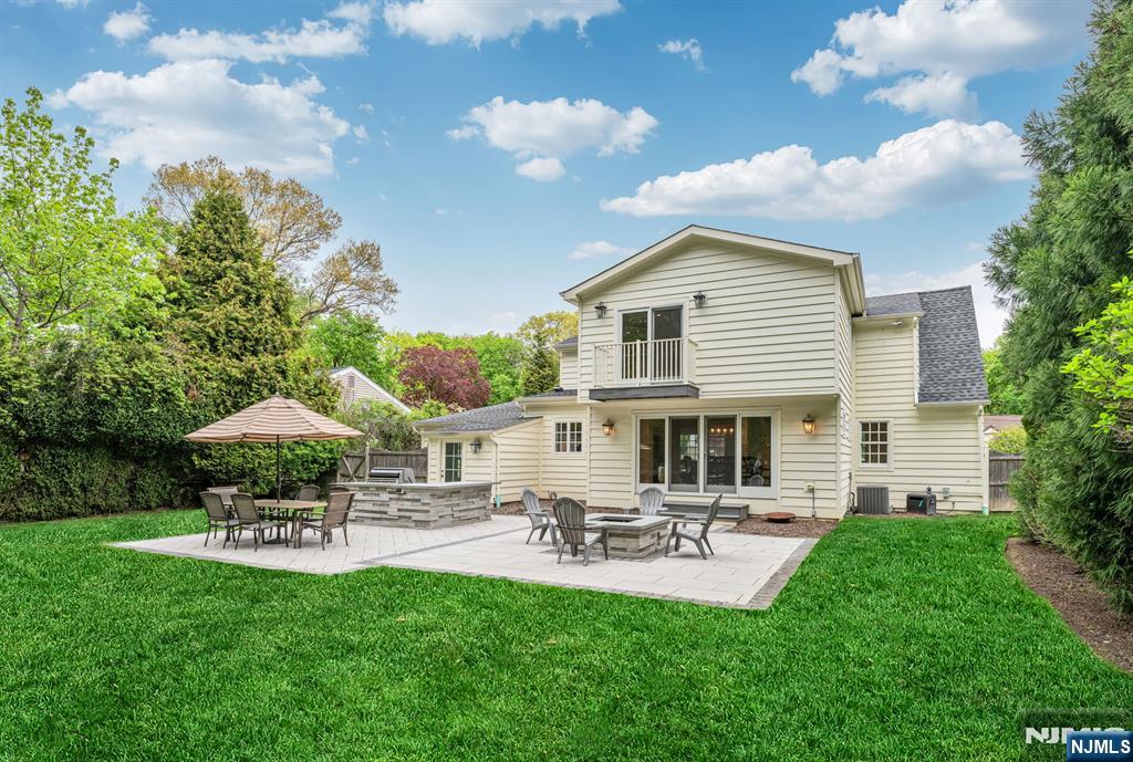 267 Merlin Place Wyckoff, NJ 07481 - Photo 48 of 49 a house view with a garden space and patio