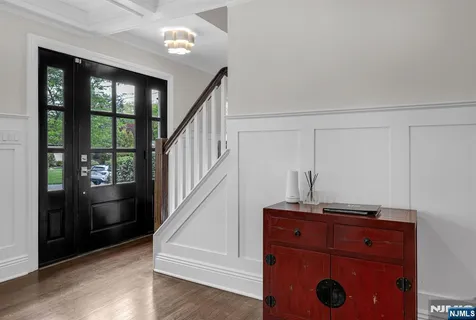 a living room with furniture a fireplace and a large window