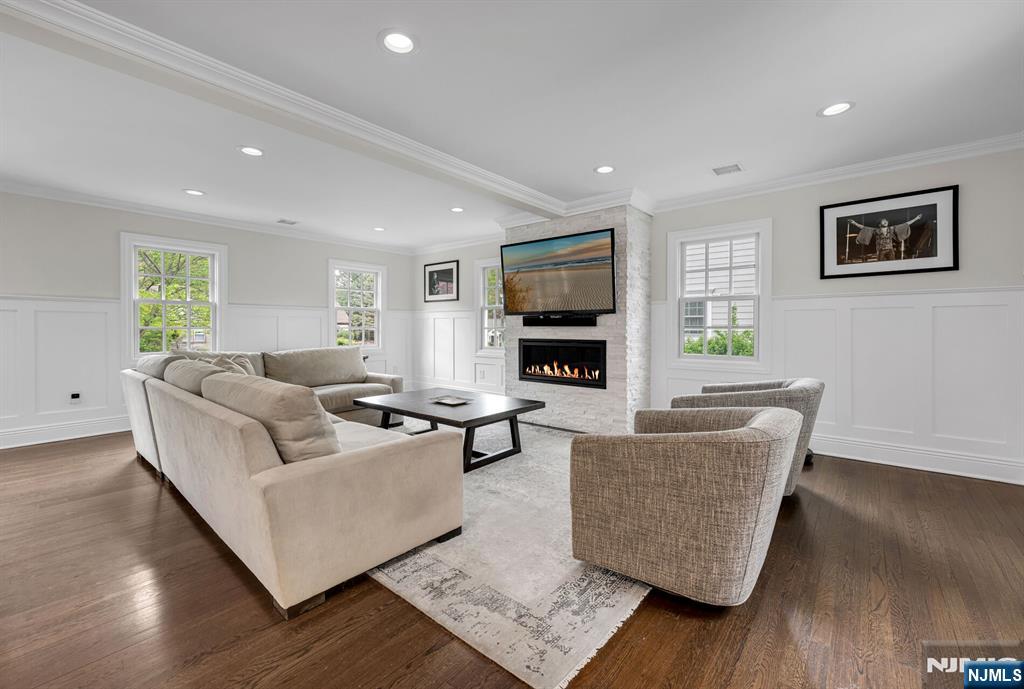 267 Merlin Place Wyckoff, NJ 07481 - Photo 7 of 49 a living room with furniture and a flat screen tv