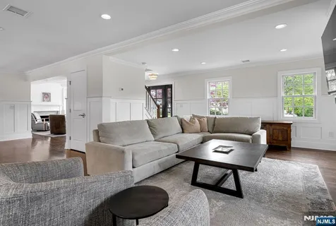 a large kitchen with a table and chairs