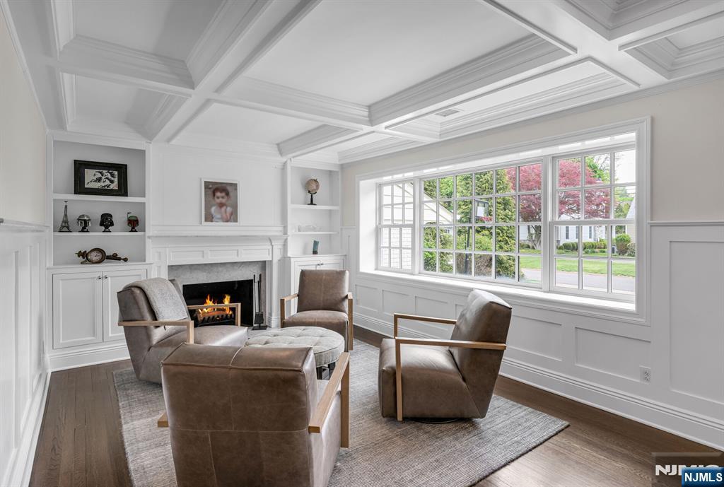 267 Merlin Place Wyckoff, NJ 07481 - Photo 10 of 49 a living room with furniture a fireplace and a large window