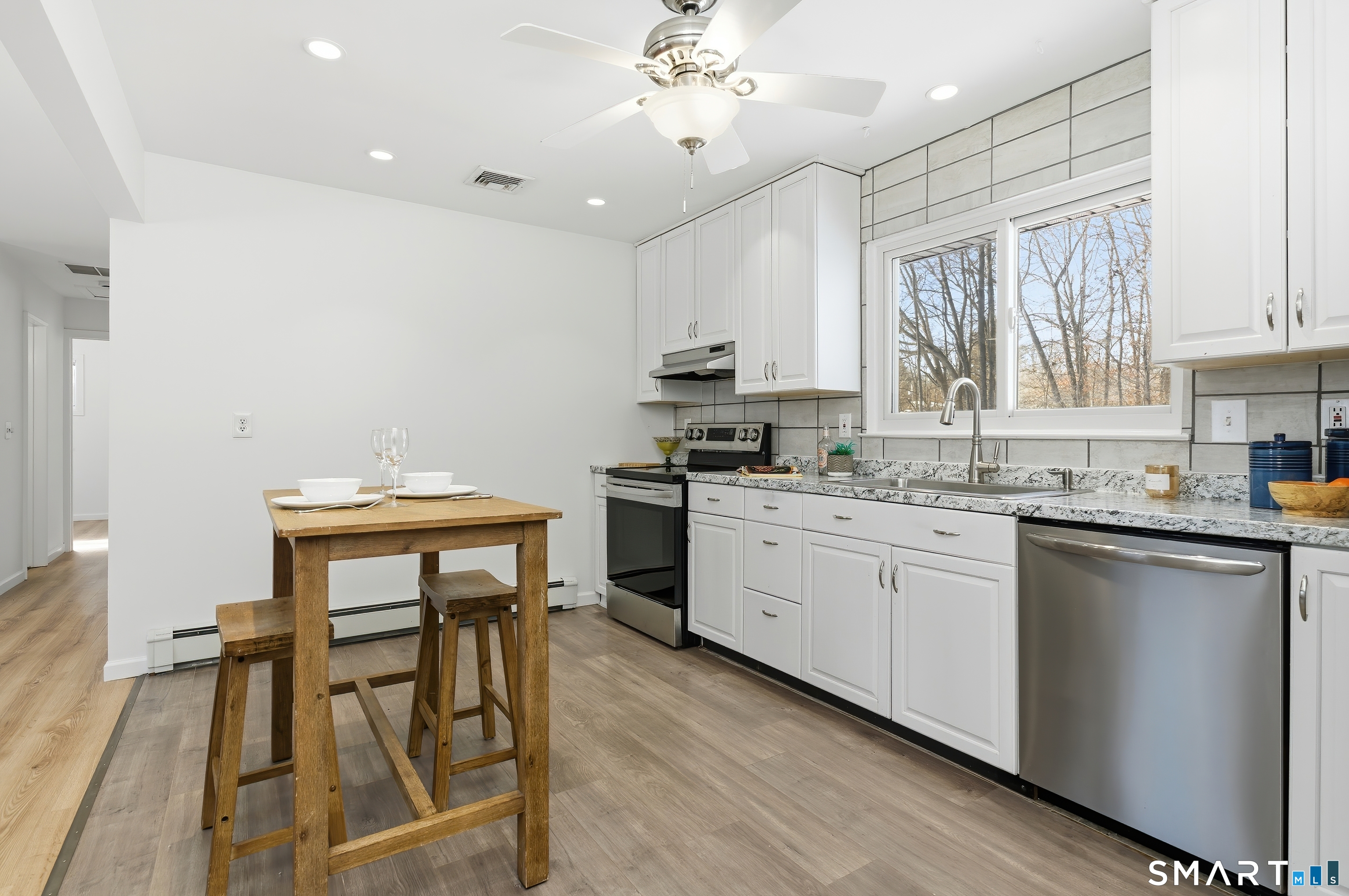 23 Ridgefield Road Wallingford, CT 06492 - Photo 12 of 28 a kitchen with a sink cabinets and window