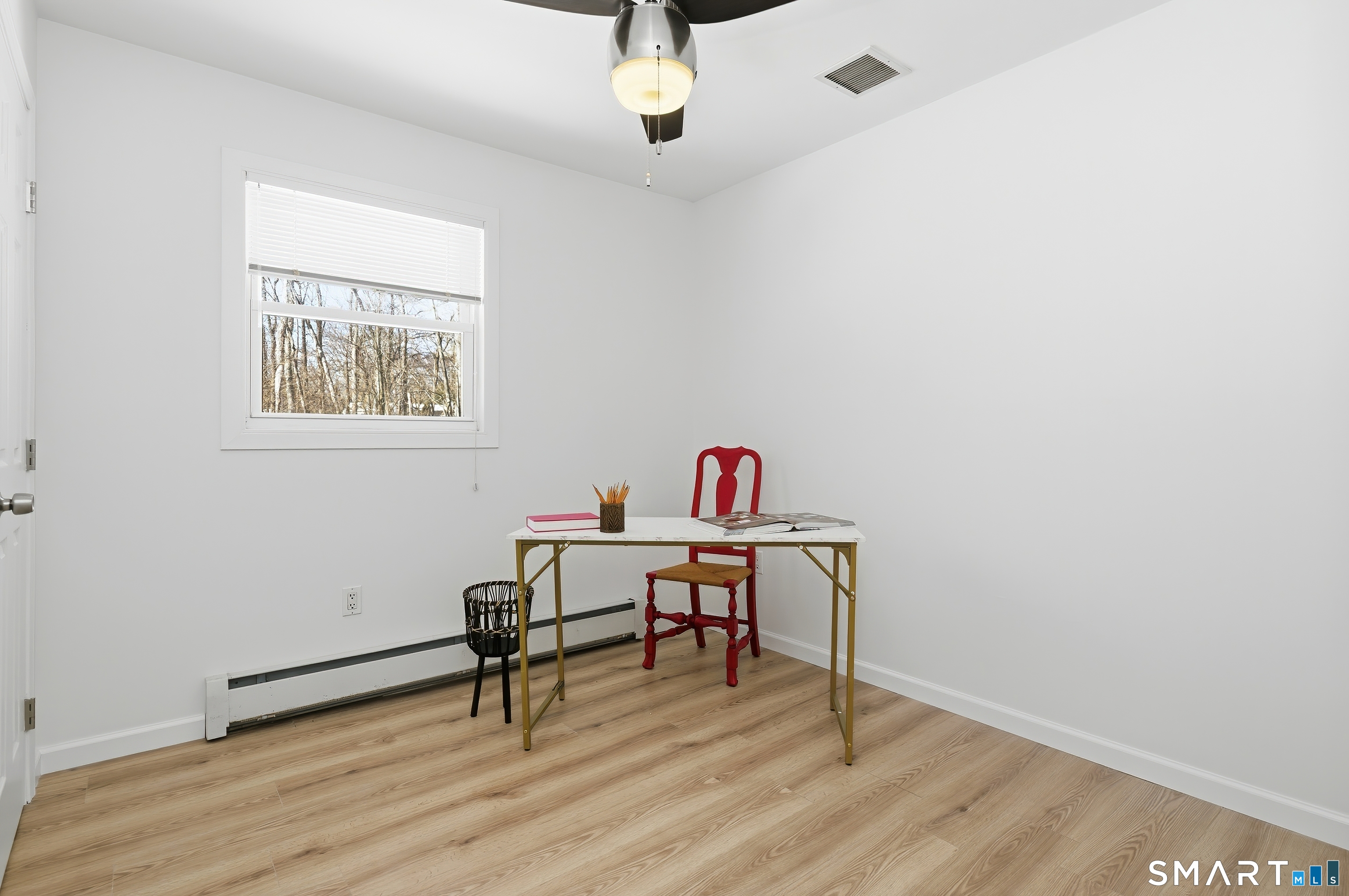 23 Ridgefield Road Wallingford, CT 06492 - Photo 14 of 28 a workspace with furniture and wooden floor