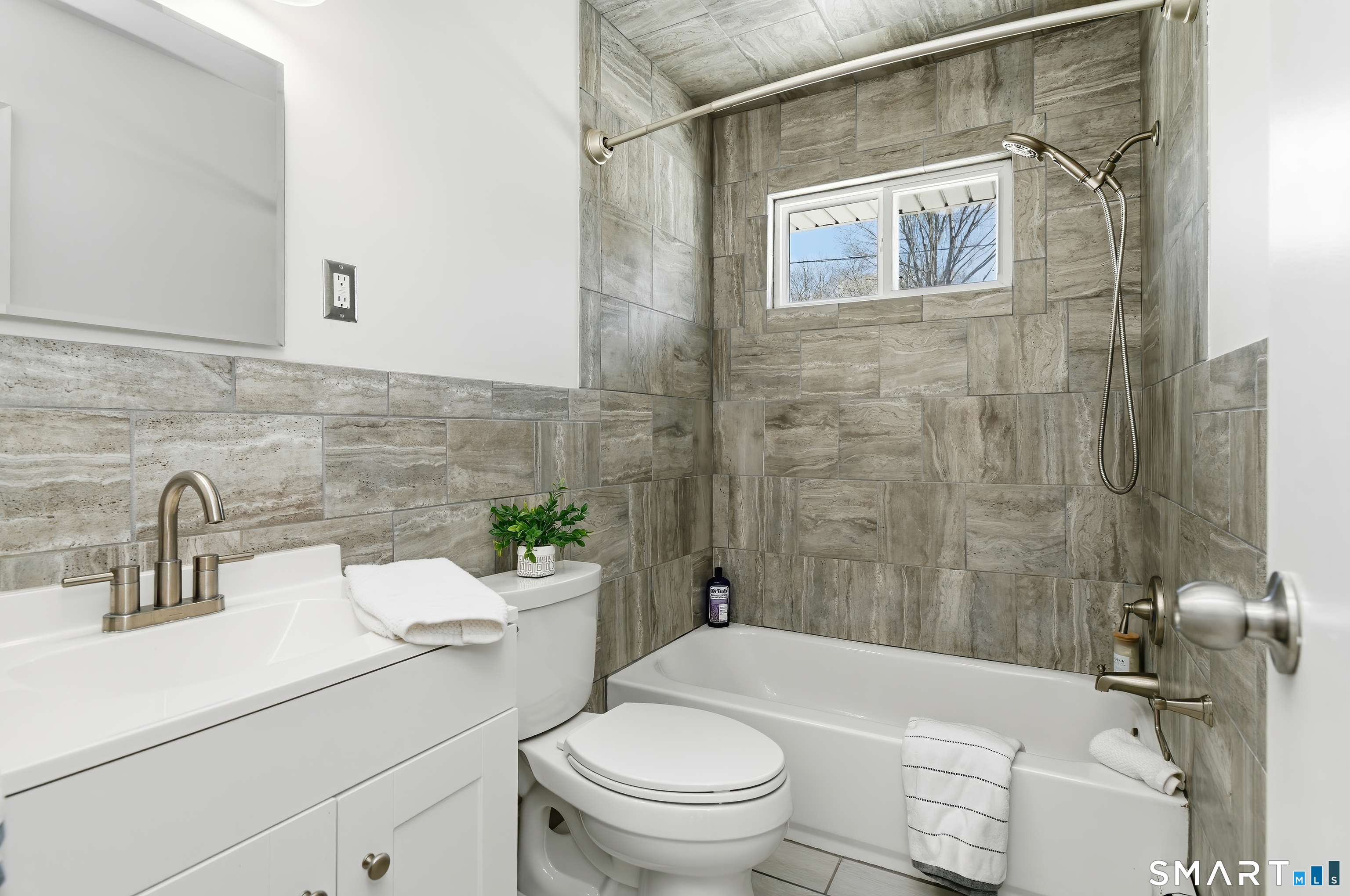 23 Ridgefield Road Wallingford, CT 06492 - Photo 16 of 28 a bathroom with a sink a toilet and shower