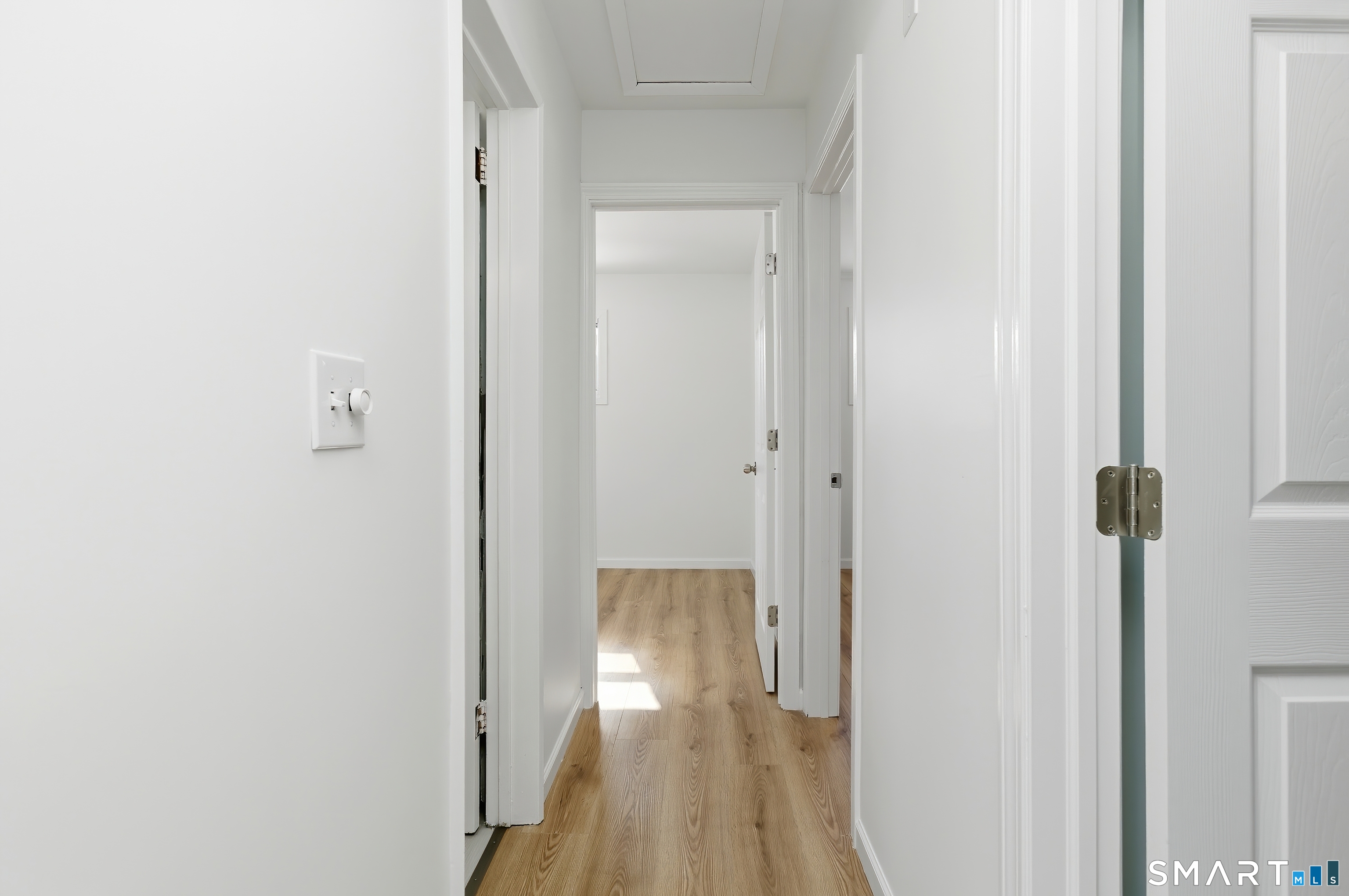 23 Ridgefield Road Wallingford, CT 06492 - Photo 23 of 28 a view of a hallway with wooden floor