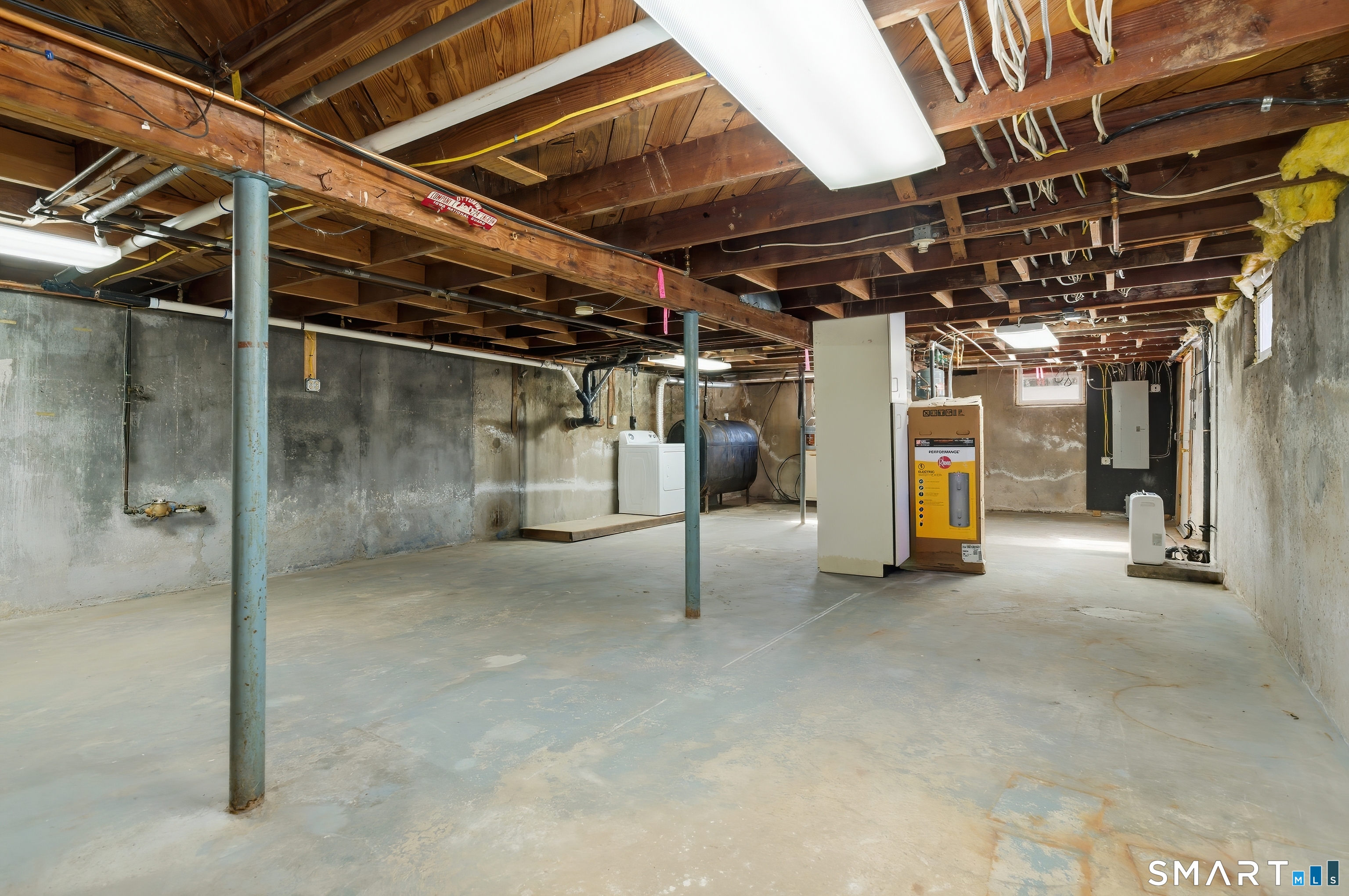 23 Ridgefield Road Wallingford, CT 06492 - Photo 24 of 28 a view of water heater room with refrigerator