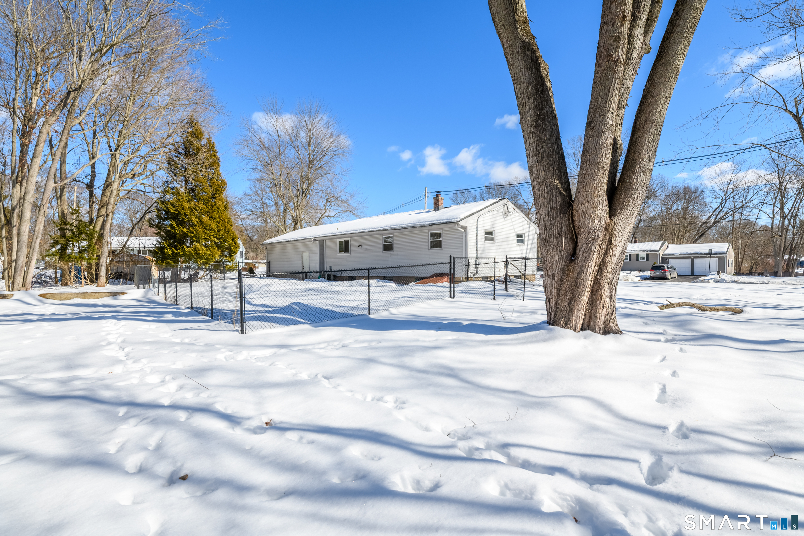 23 Ridgefield Road Wallingford, CT 06492 - Photo 4 of 28 a street view with large trees