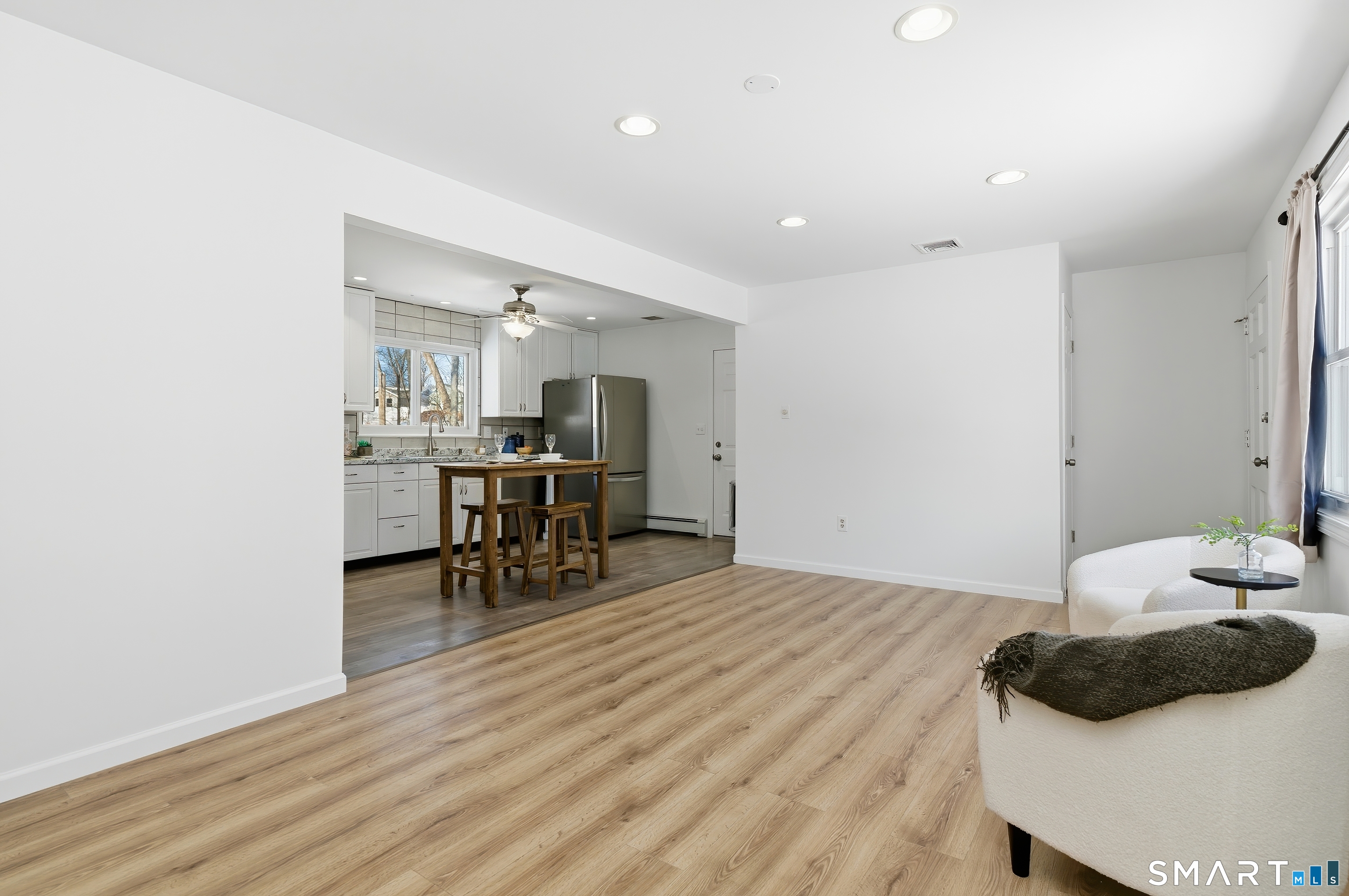 23 Ridgefield Road Wallingford, CT 06492 - Photo 9 of 28 a bedroom with furniture and a table