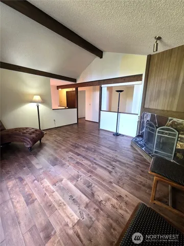a view of a livingroom with furniture and wooden floor