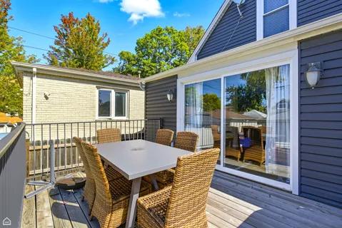 a view of a patio with a table and chairs