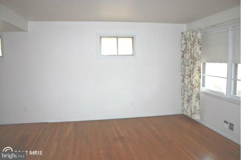 210 Cove Road Essex, MD 21221 - Photo 5 of 11 an empty room with a window