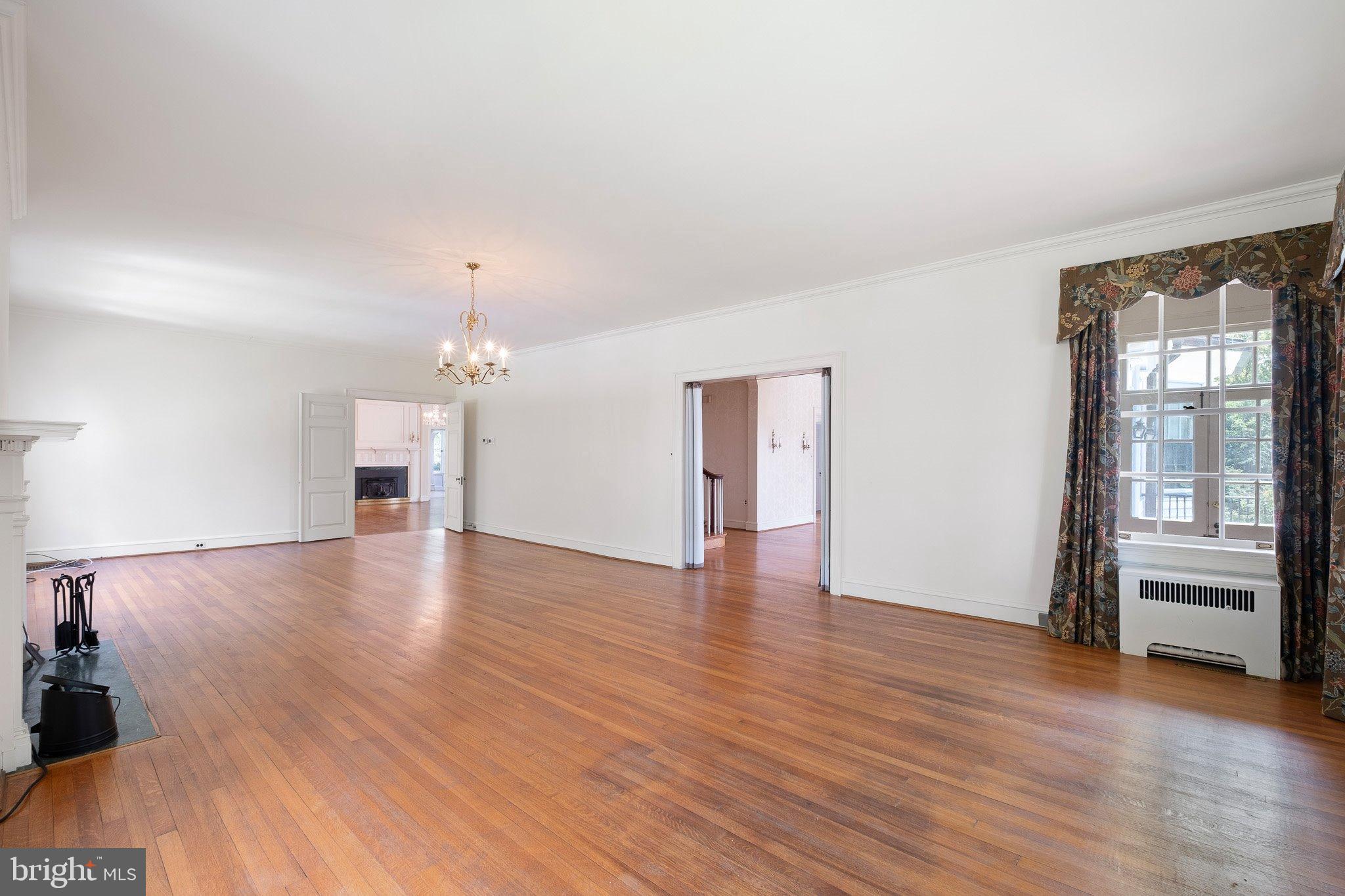 121 Gun Club Road Hockessin, DE 19707 - Photo 15 of 20 wooden floor in an empty room with a window